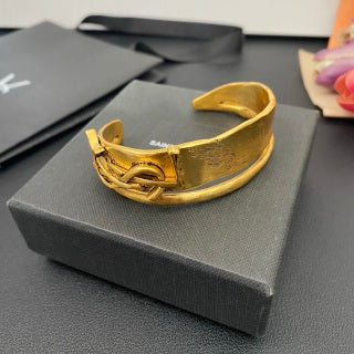 YSL Wide Monogram Engraved Gold Cuff Bracelet