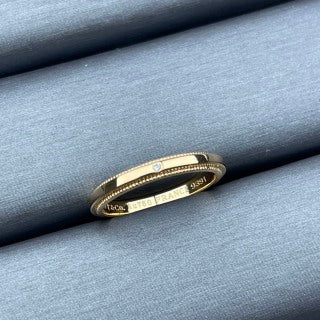 Tiffany narrow ring with a single diamond and square bead-edge detailing