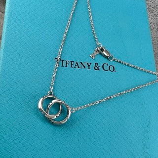 Tiffany & Co. Double-Clasp High-Polish Gold Circle Pendant Necklace with Knife-Edge Detail